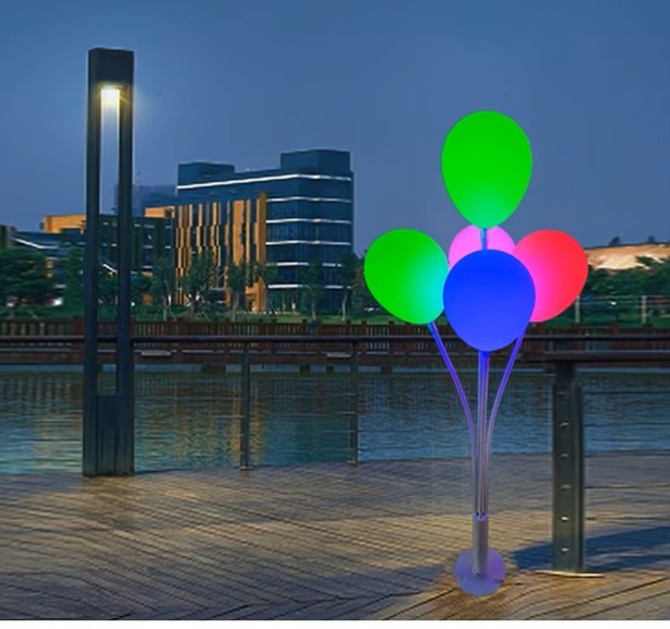 Balloon Lights — five colour-lit balloons on slender stems, lit at dusk